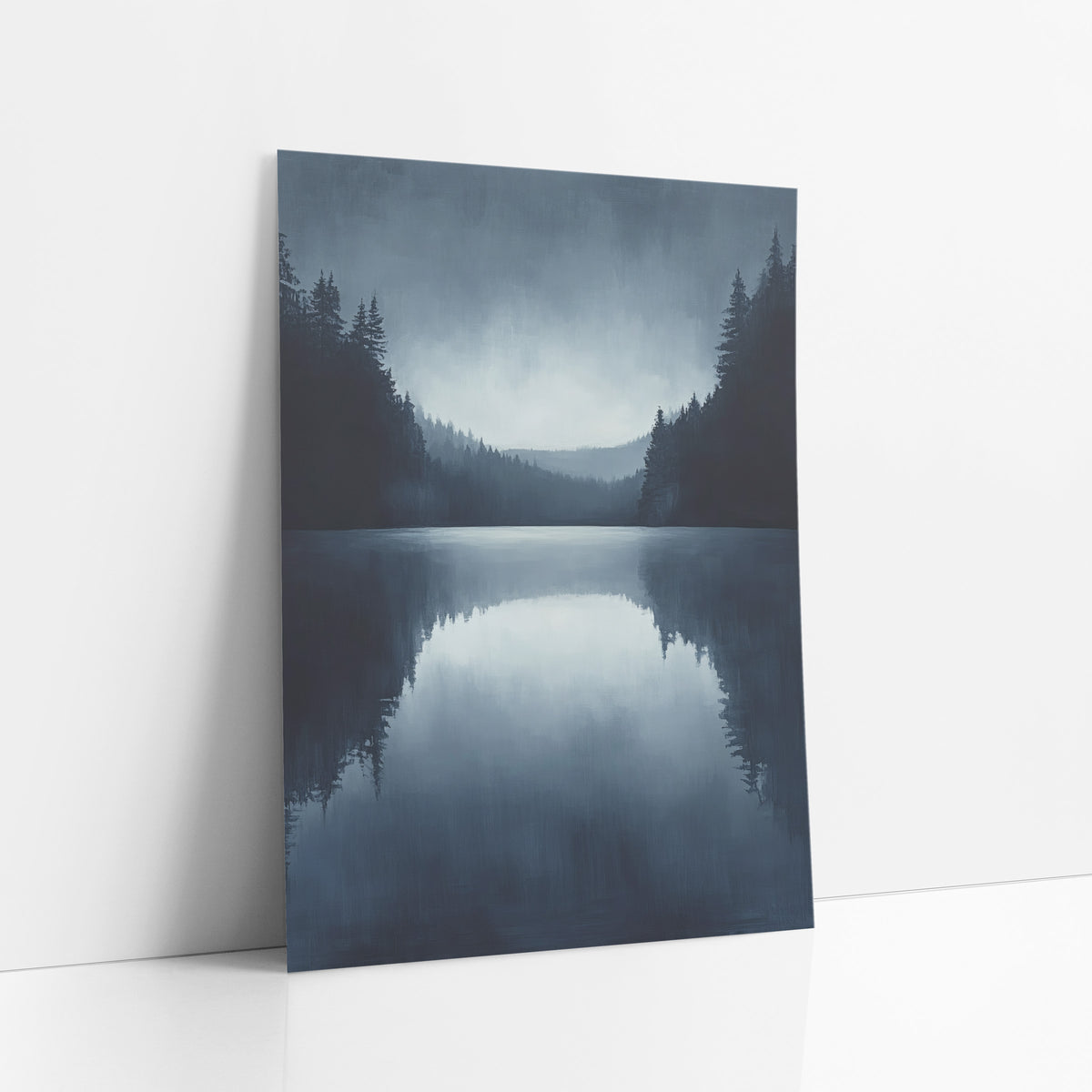 Misty Evergreen Lake Reflection Landscape art print leaning against a white wall – still lake framed by dark evergreens