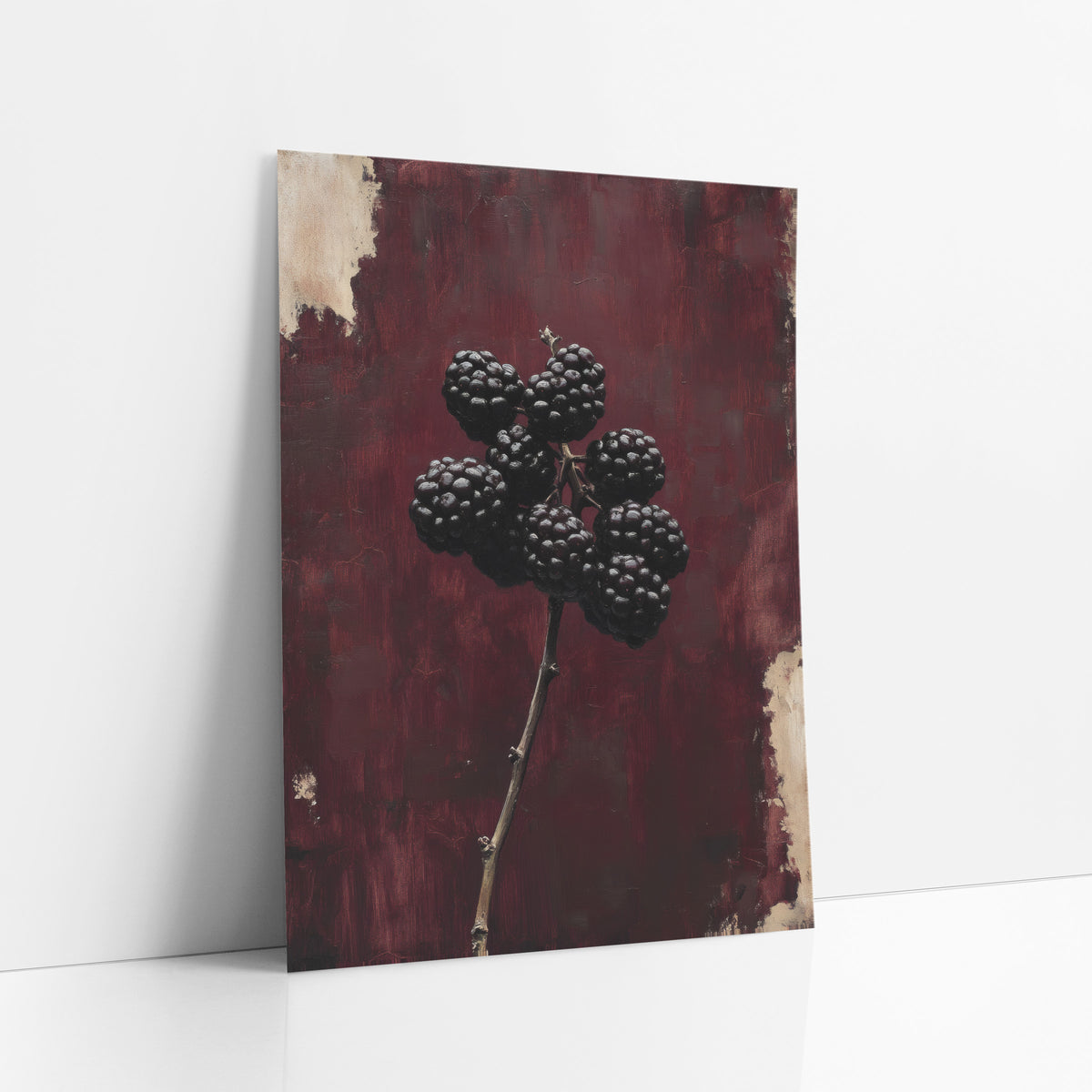 Upright Blackberry Stem Oxblood Botanical art print leaning against a white wall – cluster of glossy dark blackberries