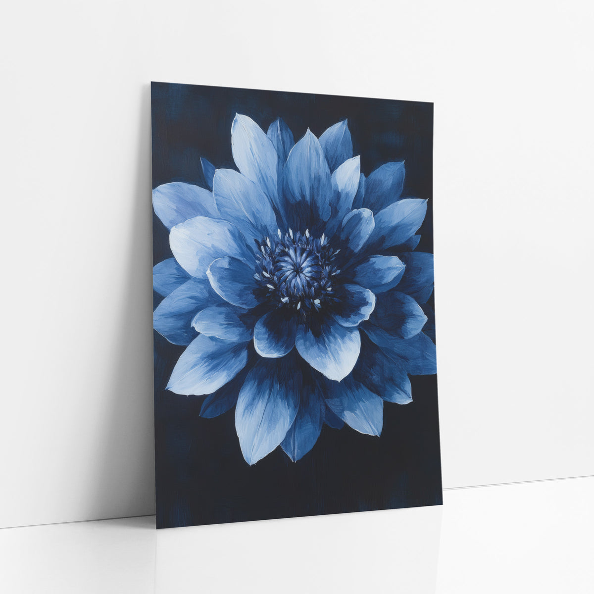 Midnight Mandala Dahlia Symmetrical Floral art print leaning against a white wall – large layered blue flower with pale