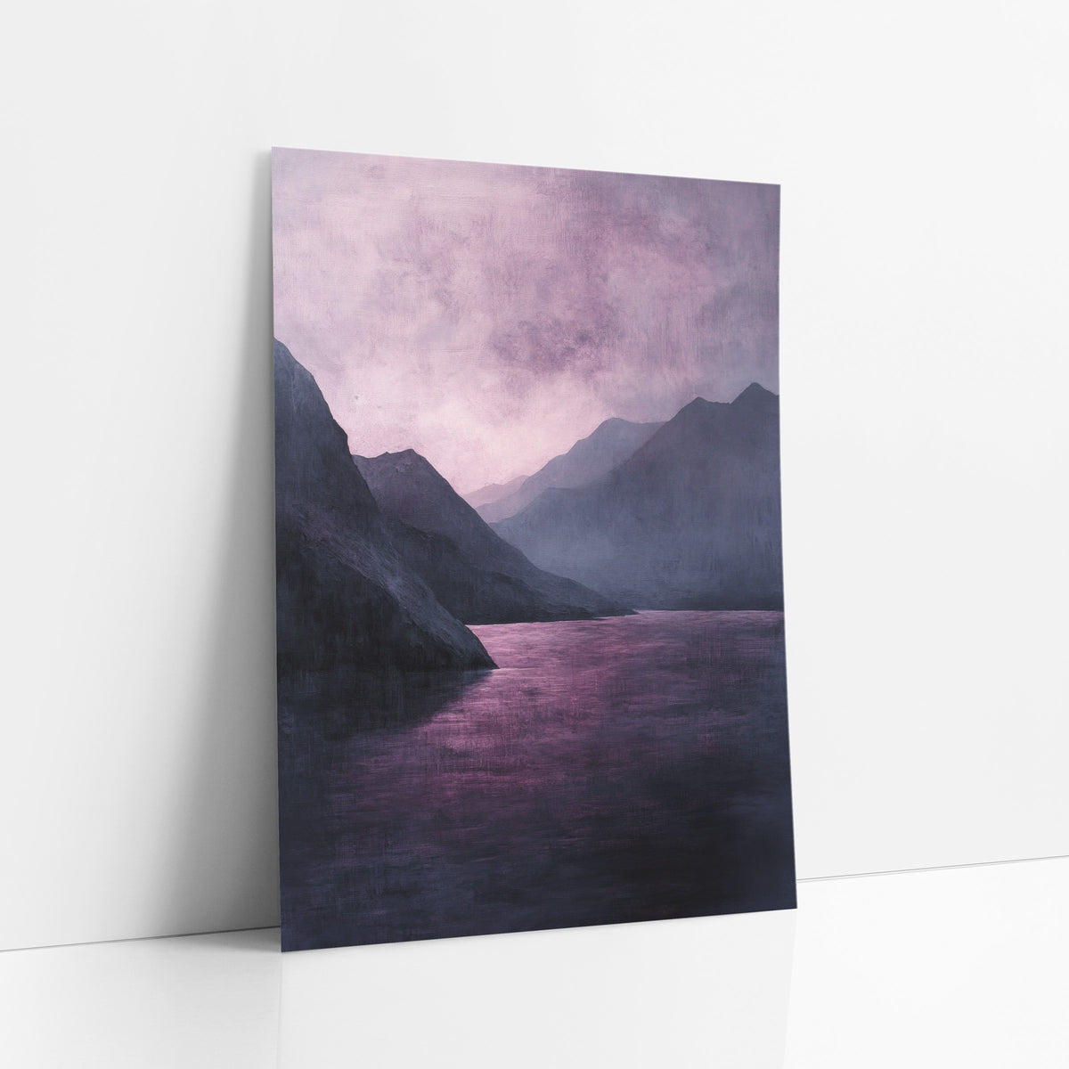 Violet Mountain Lake Landscape Moody art print leaning against a white wall – moody landscape of a plum-pink lake between