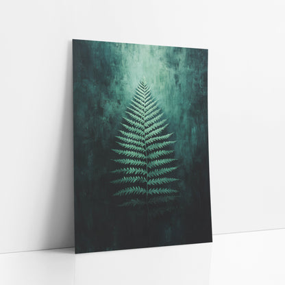 Emerald Fern Frond Botanical art print leaning against a white wall – single pale green fern frond glowing against a dark