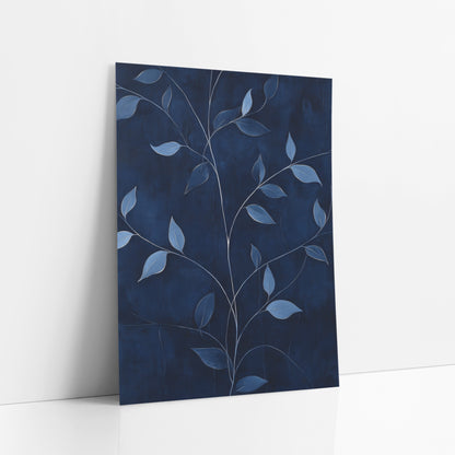 Navy Blue Vine Leaf Botanical art print leaning against a white wall – branching vine stems with dusty blue leaves and pale