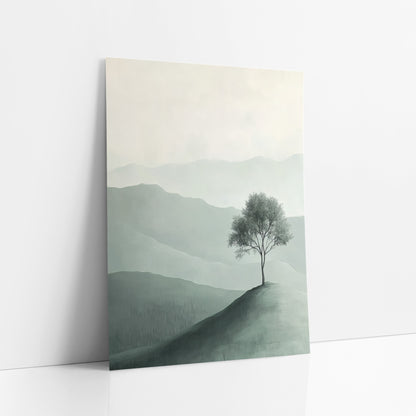 Sage Slope Sapling Minimalist Landscape art print leaning against a white wall – lone leafy tree on a green hilltop