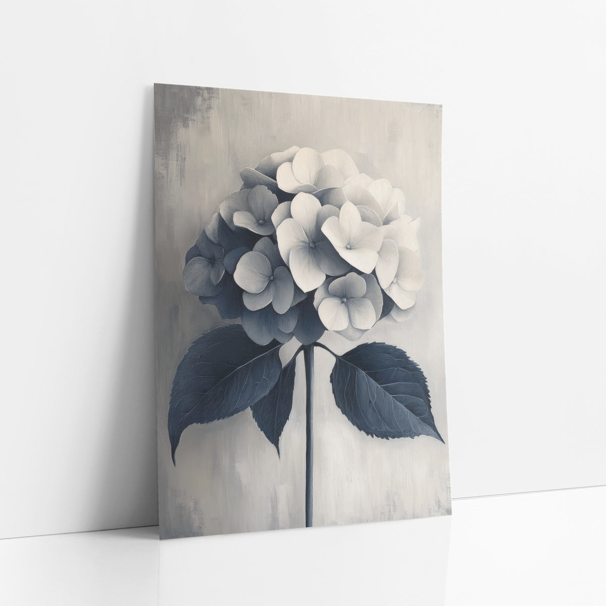 Navy Gray Hydrangea Tone on Tone art print leaning against a white wall – hydrangea flower head fading from cream to navy