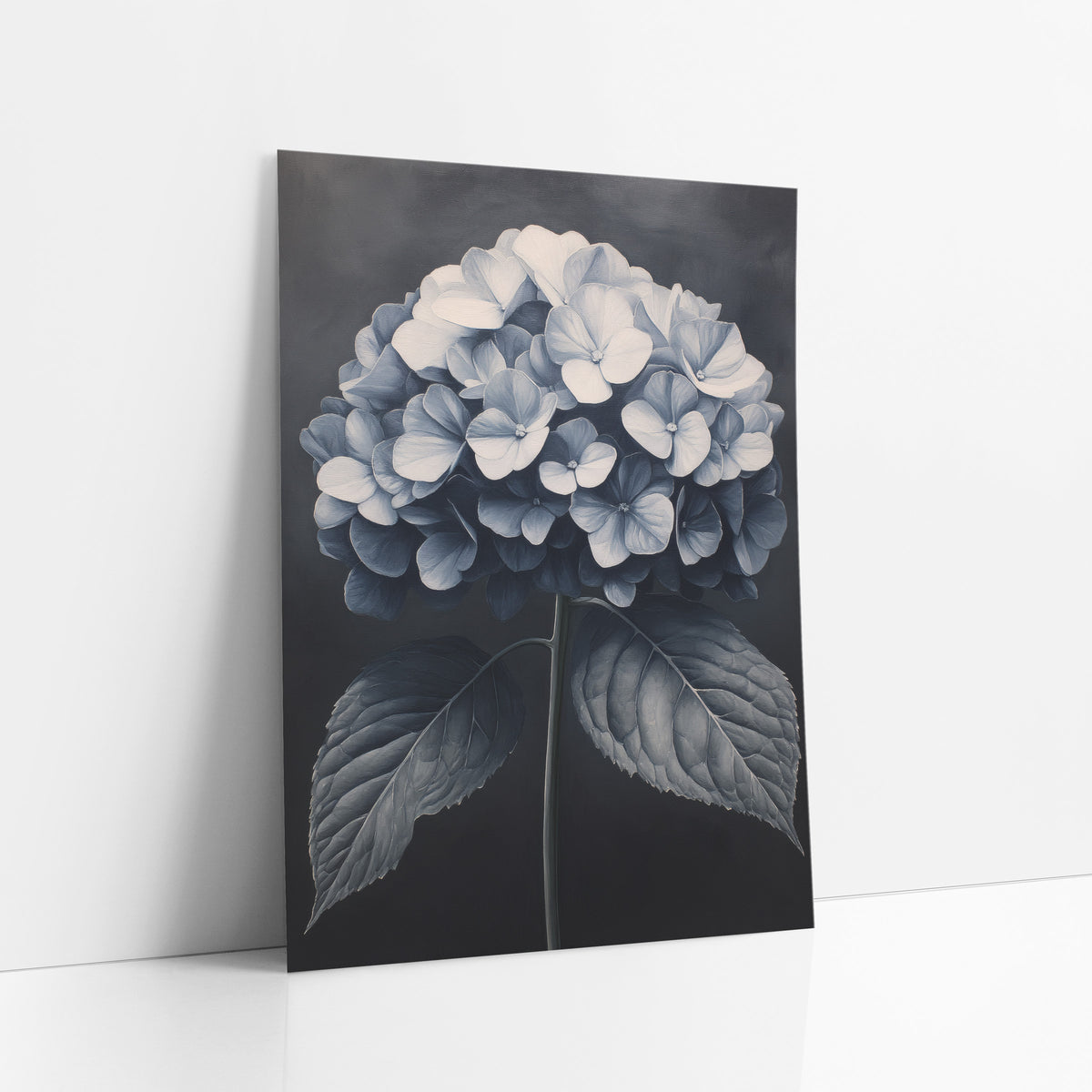 Moonlit Hydrangea Dome Charcoal Luxe art print leaning against a white wall – round hydrangea bloom in ivory and slate blue