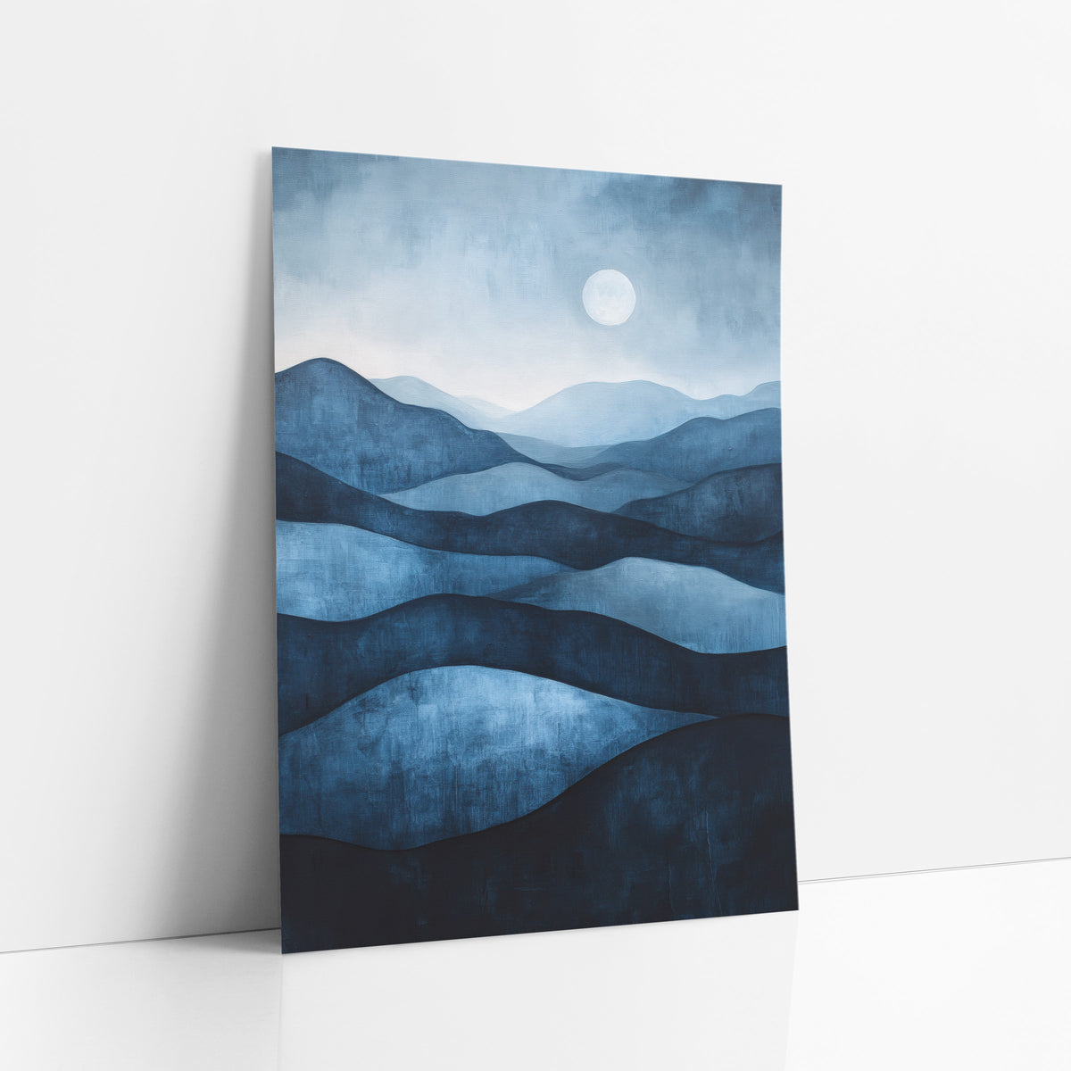 Indigo Layered Hills Moonlit Landscape art print leaning against a white wall – layered indigo and navy hills fading