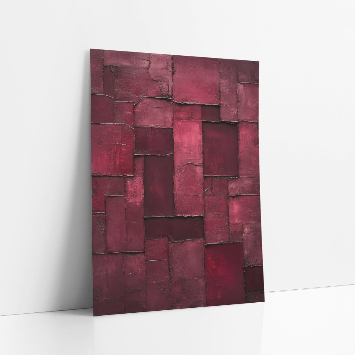 Burgundy Rectangle Patchwork Abstract art print leaning against a white wall – abstract burgundy and raspberry rectangles