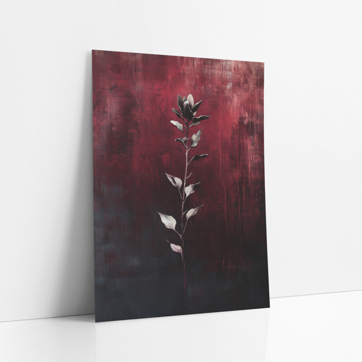 Crimson Botanical Stem Moody Abstract art print leaning against a white wall – slender flower stem with silvery leaves