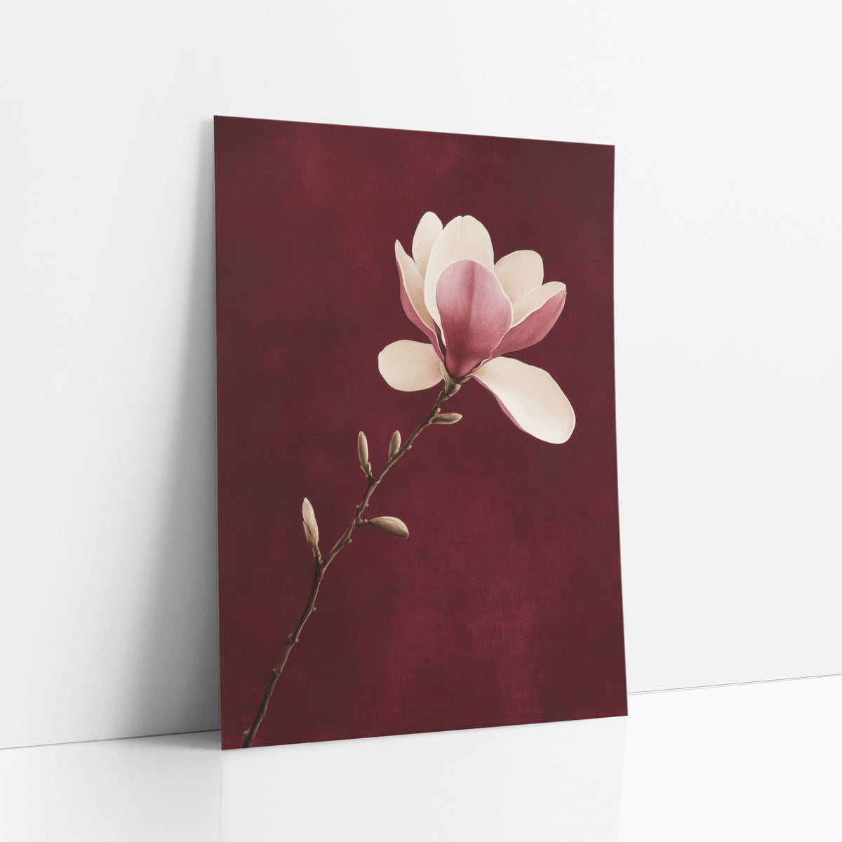 Single Magnolia Stem Burgundy Botanical art print leaning against a white wall – cream and pink magnolia blossom on a slender