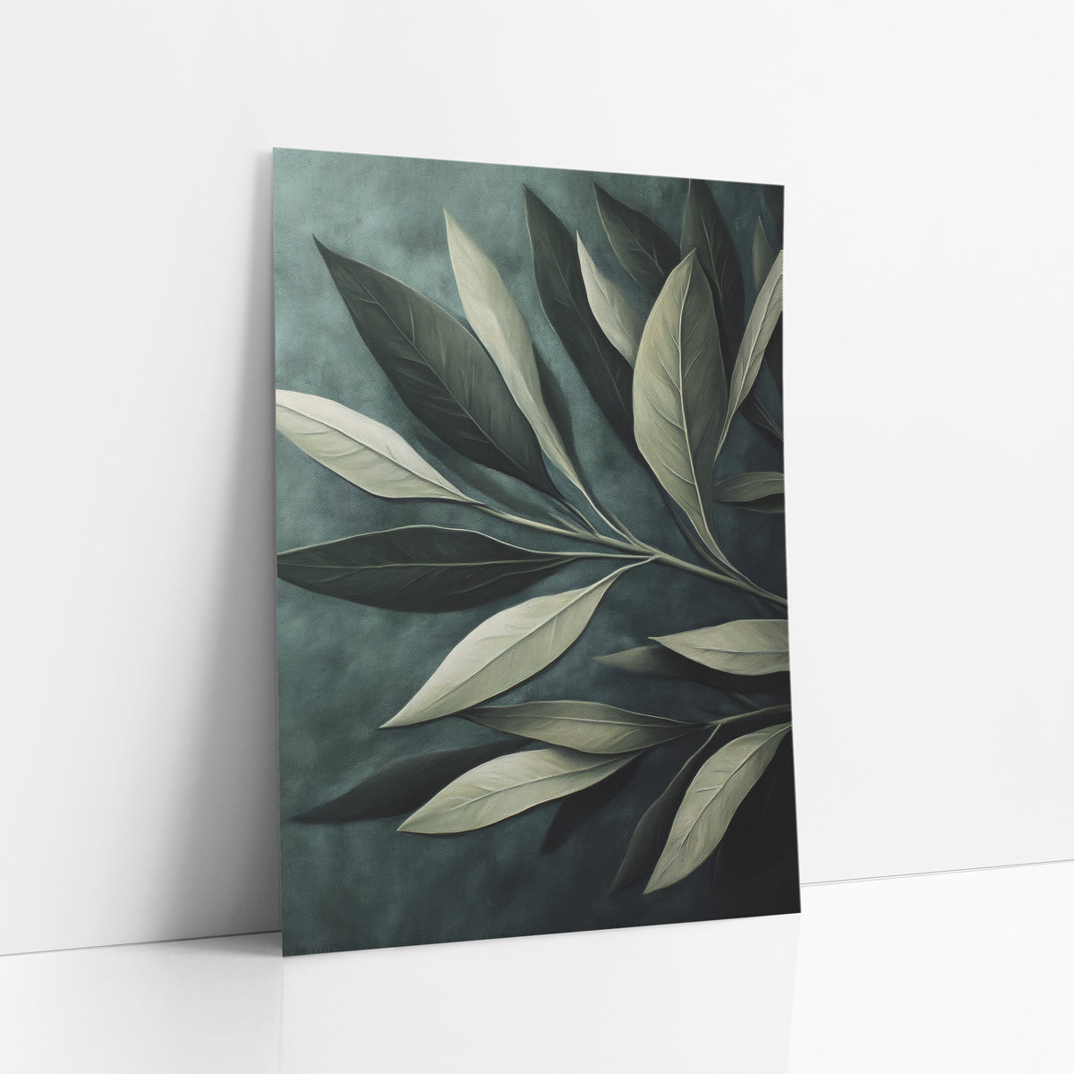Sage Green Olive Leaf Botanical art print leaning against a white wall – close view of large olive leaves on one branch