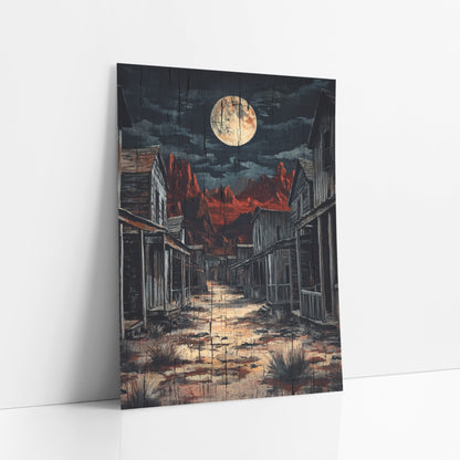 Moonlit Ghost Town Western art print leaning against a white wall – full moon over an empty western street of weathered