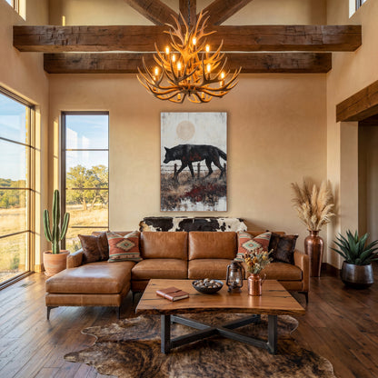 Black Wolf Fence Line Western wall art in a rustic western-style room – black wolf walking past a barbed wire fence