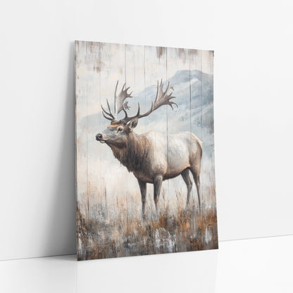 Grand Antler Elk Snowy Ridge art print leaning against a white wall – bull elk with wide antlers standing in dry meadow grass