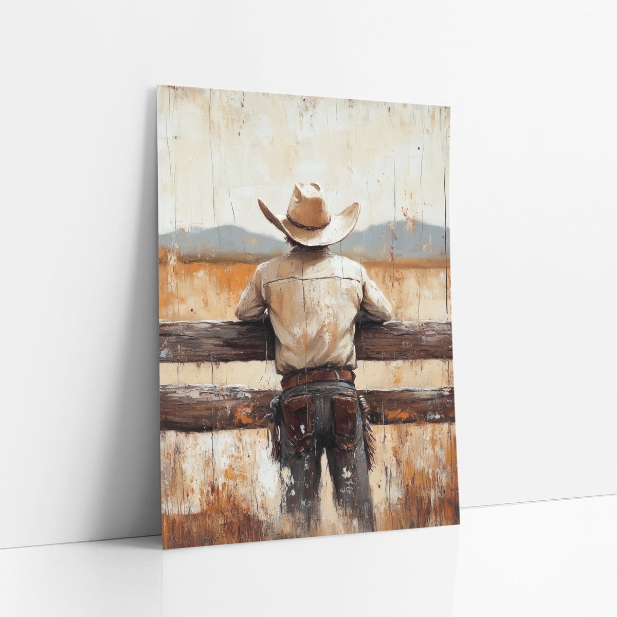 Cowboy Back View Western art print leaning against a white wall – cowboy seen from behind leaning on a wooden fence, looking