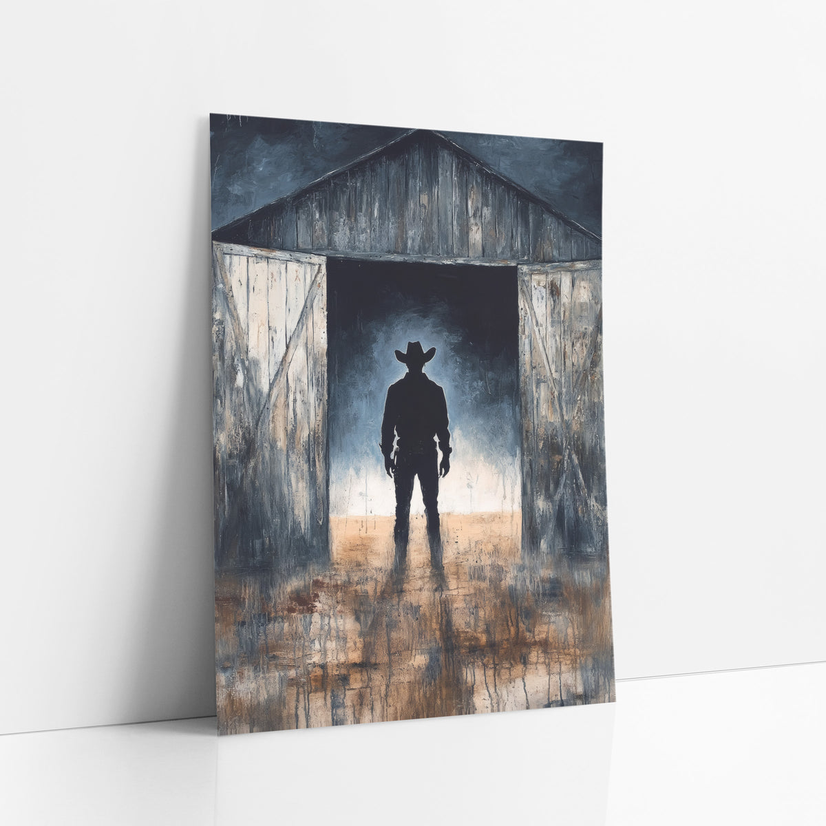 Cowboy Silhouette Barn Doorway Western art print leaning against a white wall – silhouette of a cowboy in a wide-brimmed hat