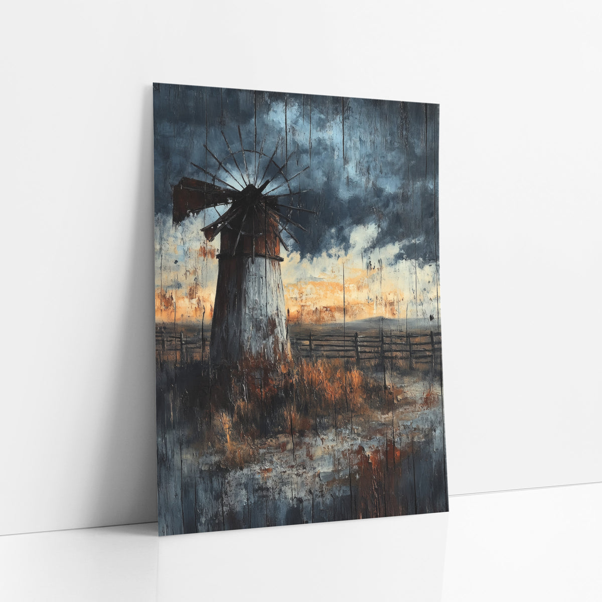 Weathered Windmill Prairie Western Landscape art print leaning against a white wall – old windmill with a bent wheel