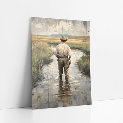 Prairie Stream Fly Fisherman Western art print leaning against a white wall – man in a wide-brimmed hat fly fishing
