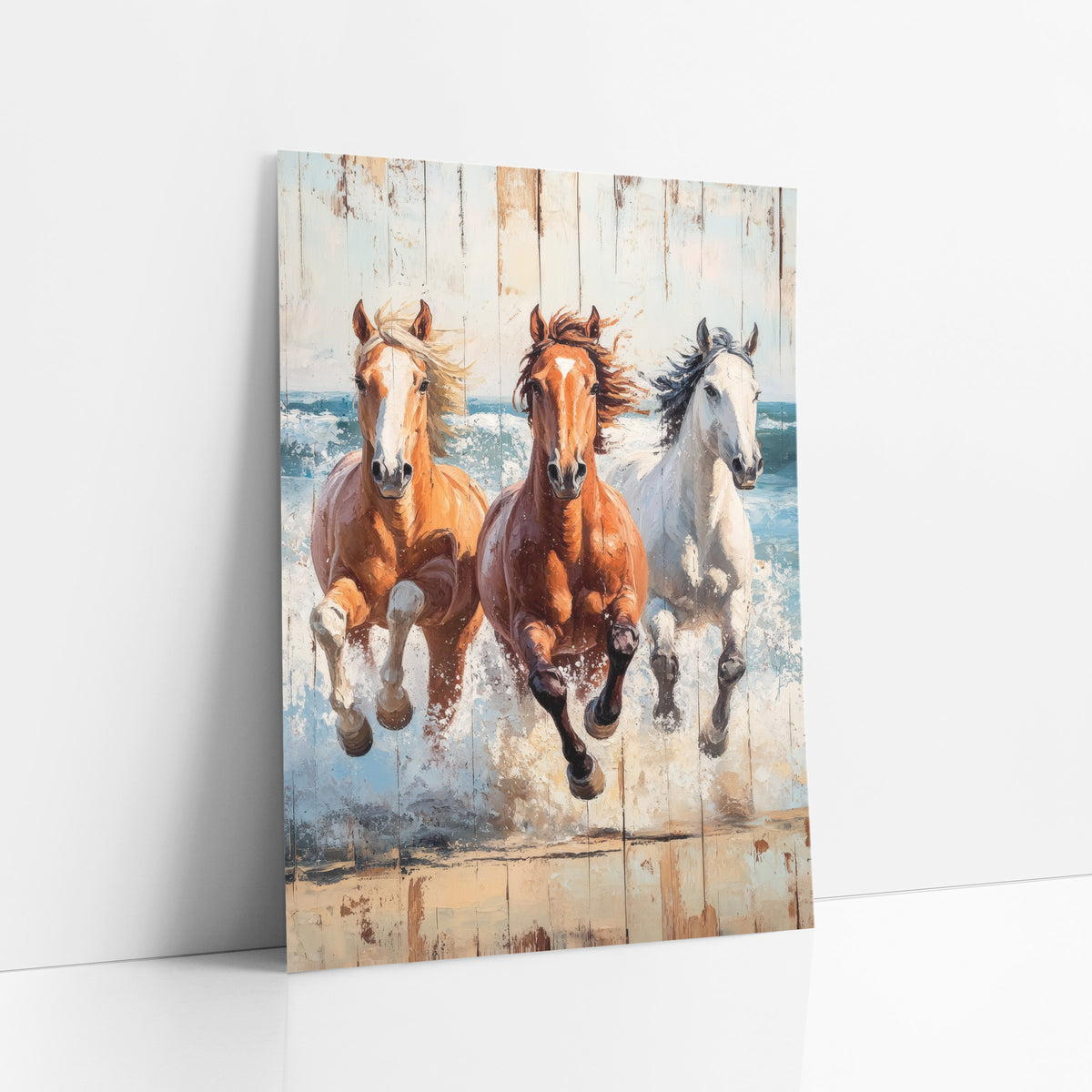 Three Horses Galloping Coastal Western art print leaning against a white wall – three galloping horses in palomino, chestnut