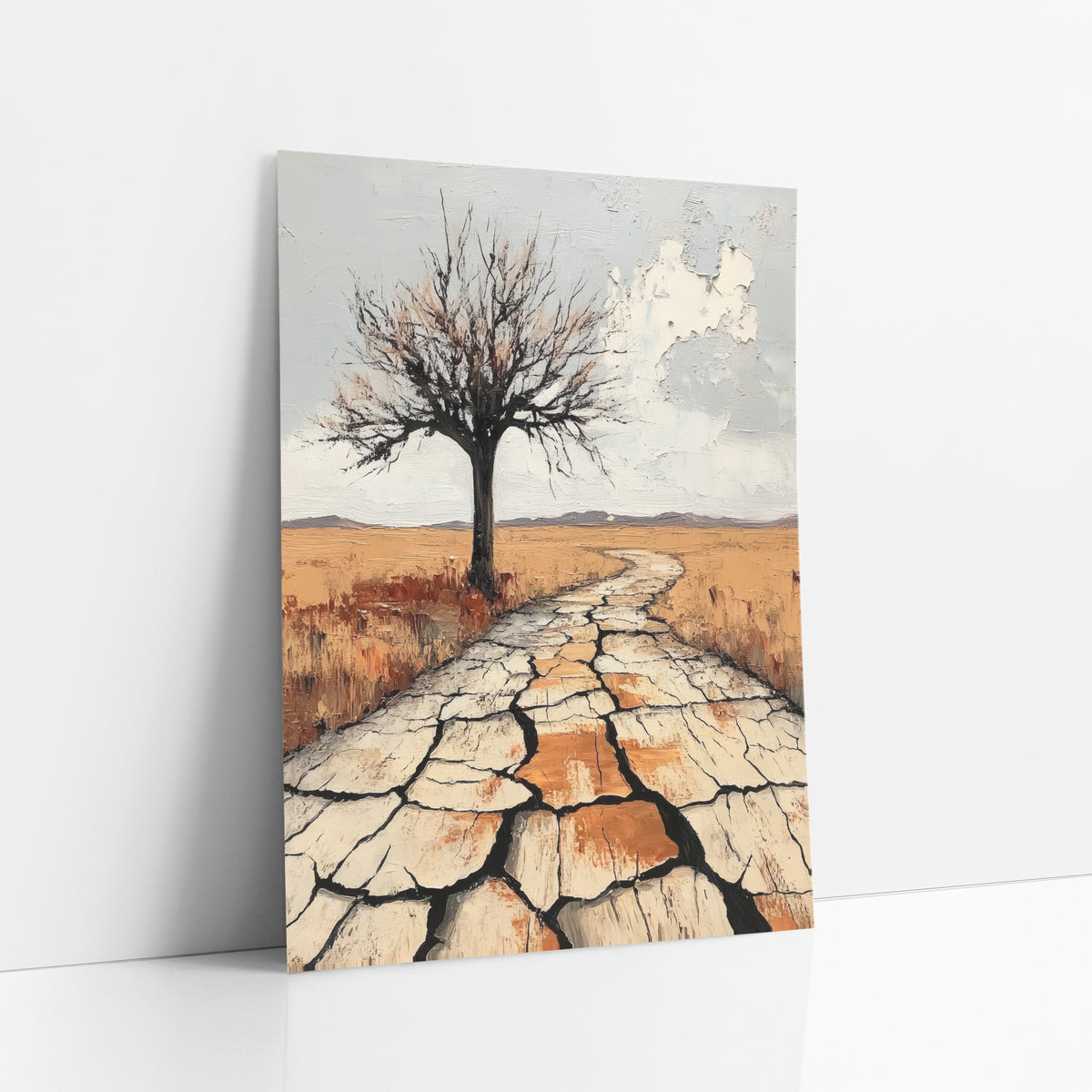 Lone Bare Tree Western Desert art print leaning against a white wall – lone bare tree beside a winding path of cracked pale