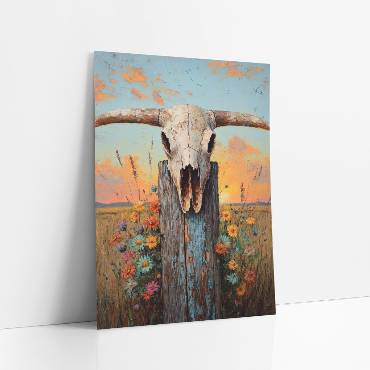 Longhorn Skull Wildflower Western art print leaning against a white wall – longhorn skull on a weathered blue-gray fence post