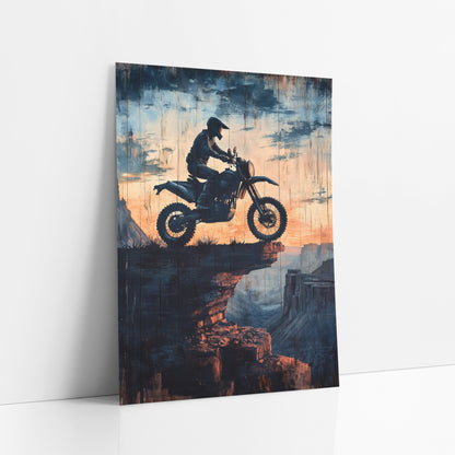 Airborne Dirt Biker Canyon Ledge Distressed art print leaning against a white wall – silhouette of a helmeted dirt bike rider