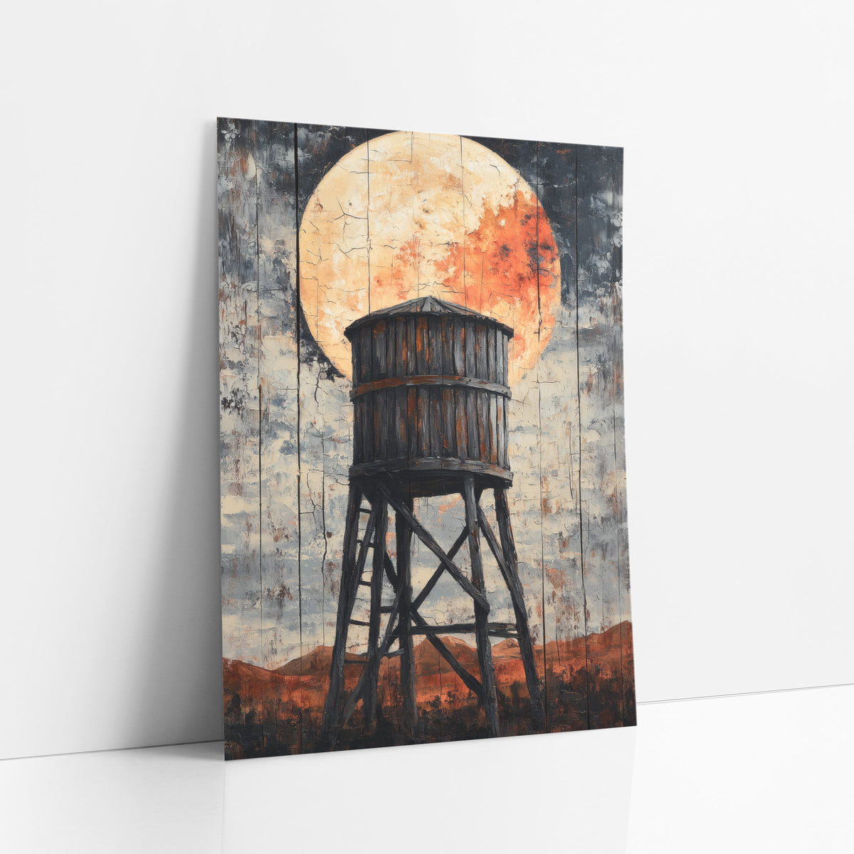 Ember Moon Mesa Tower Distressed art print leaning against a white wall – old wooden water tower on tall braced legs in front