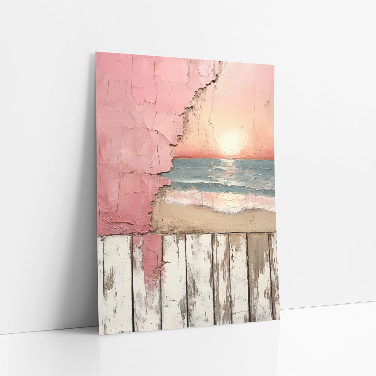 Pink Sunset Beach Peeling Plaster art print leaning against a white wall – pink sunset over blue-green waves and sand, seen