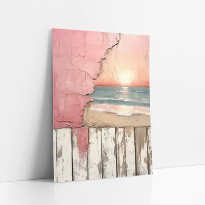 Pink Sunset Beach Peeling Plaster art print leaning against a white wall – pink sunset over blue-green waves and sand, seen