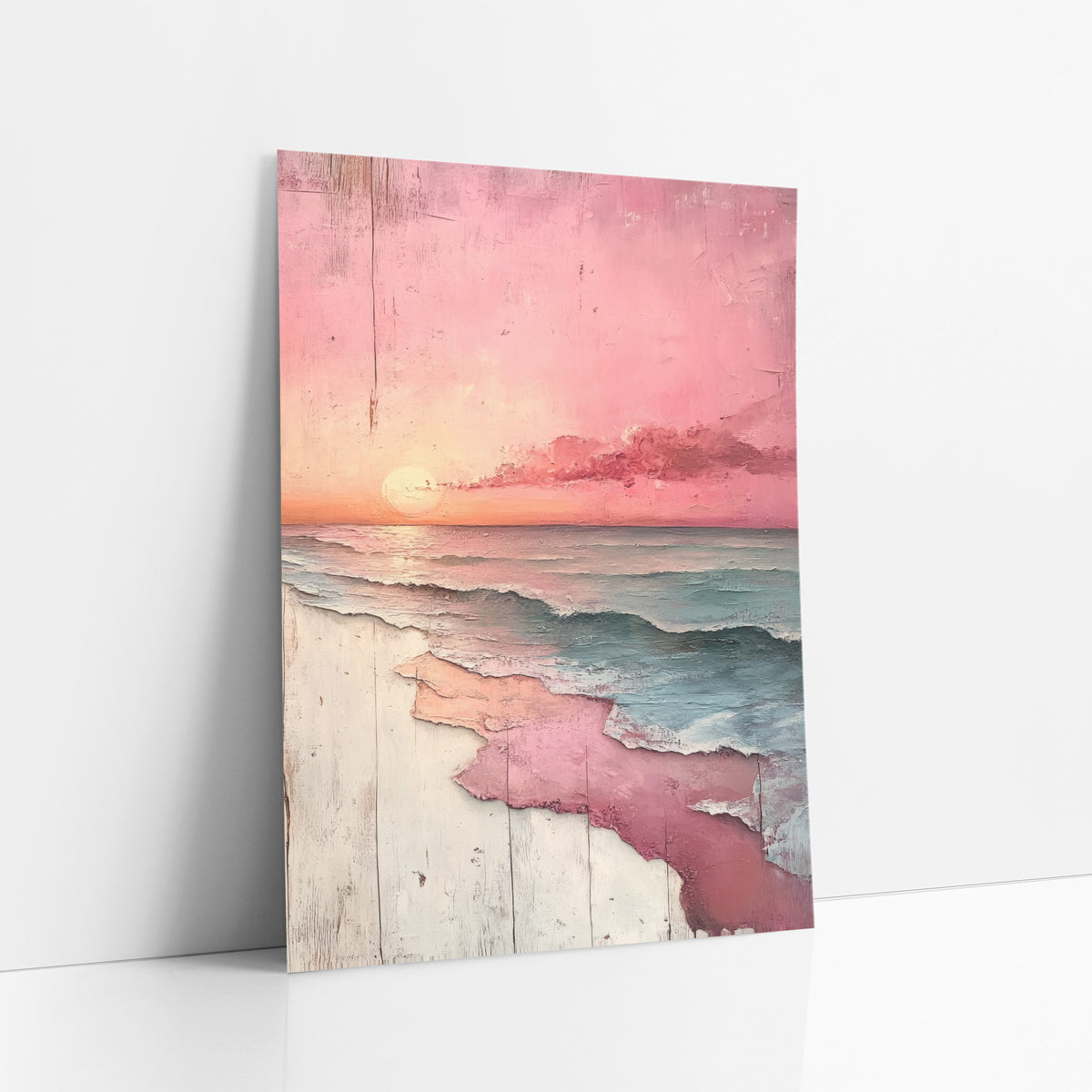 Blush Pink Sunset Seascape Coastal art print leaning against a white wall – pink sunset over teal ocean waves with a peach