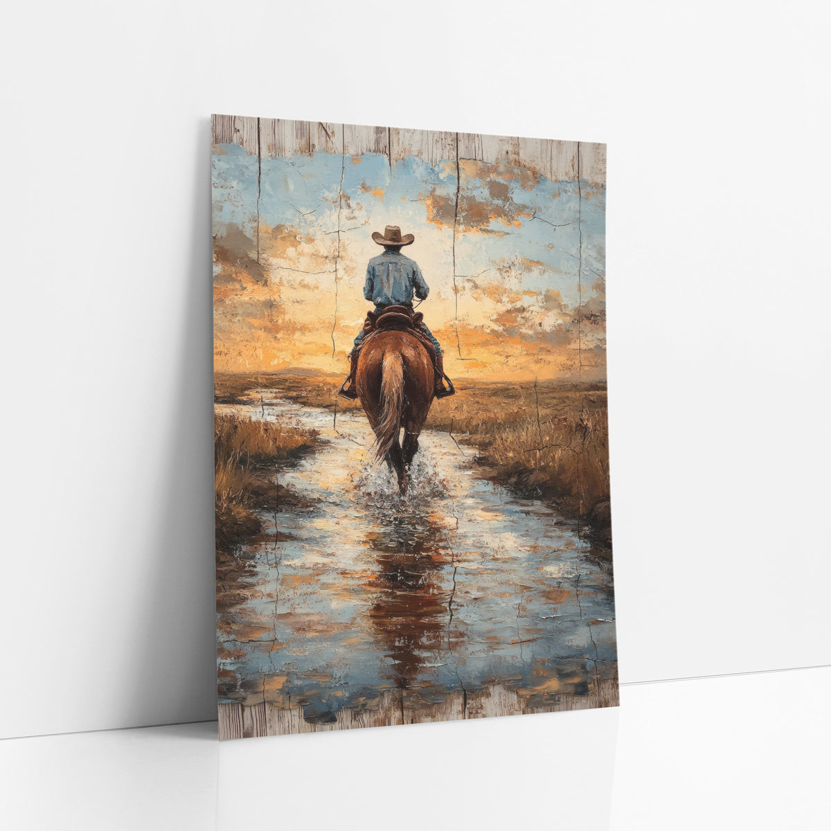 Cowboy Crossing Stream Western Rustic art print leaning against a white wall – cowboy on a chestnut horse crossing shallow
