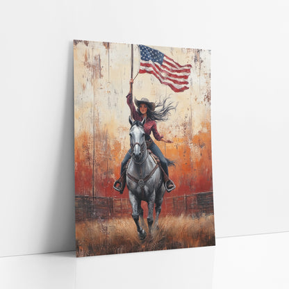 Sunset Arena Cowgirl Flagbearer Painterly art print leaning against a white wall – cowgirl in cowboy hat galloping a gray
