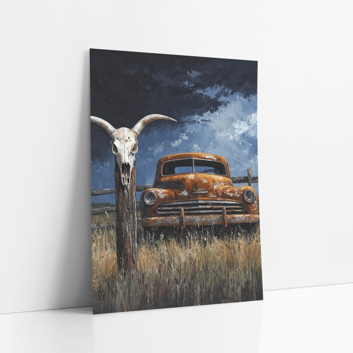 Stormfront Fence Skull Rusty Truck art print leaning against a white wall – rusted orange old truck in tall dry grass