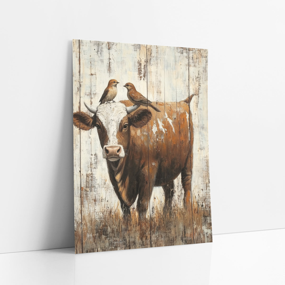 Rustic Cow With Perched Birds art print leaning against a white wall – brown and white cow with two small birds perched