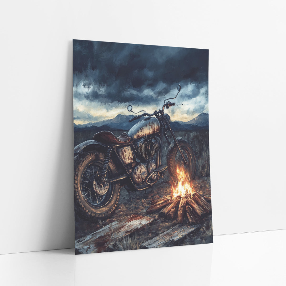 Vintage Motorcycle Campfire Western Scene art print leaning against a white wall – vintage motorcycle with a worn tank parked