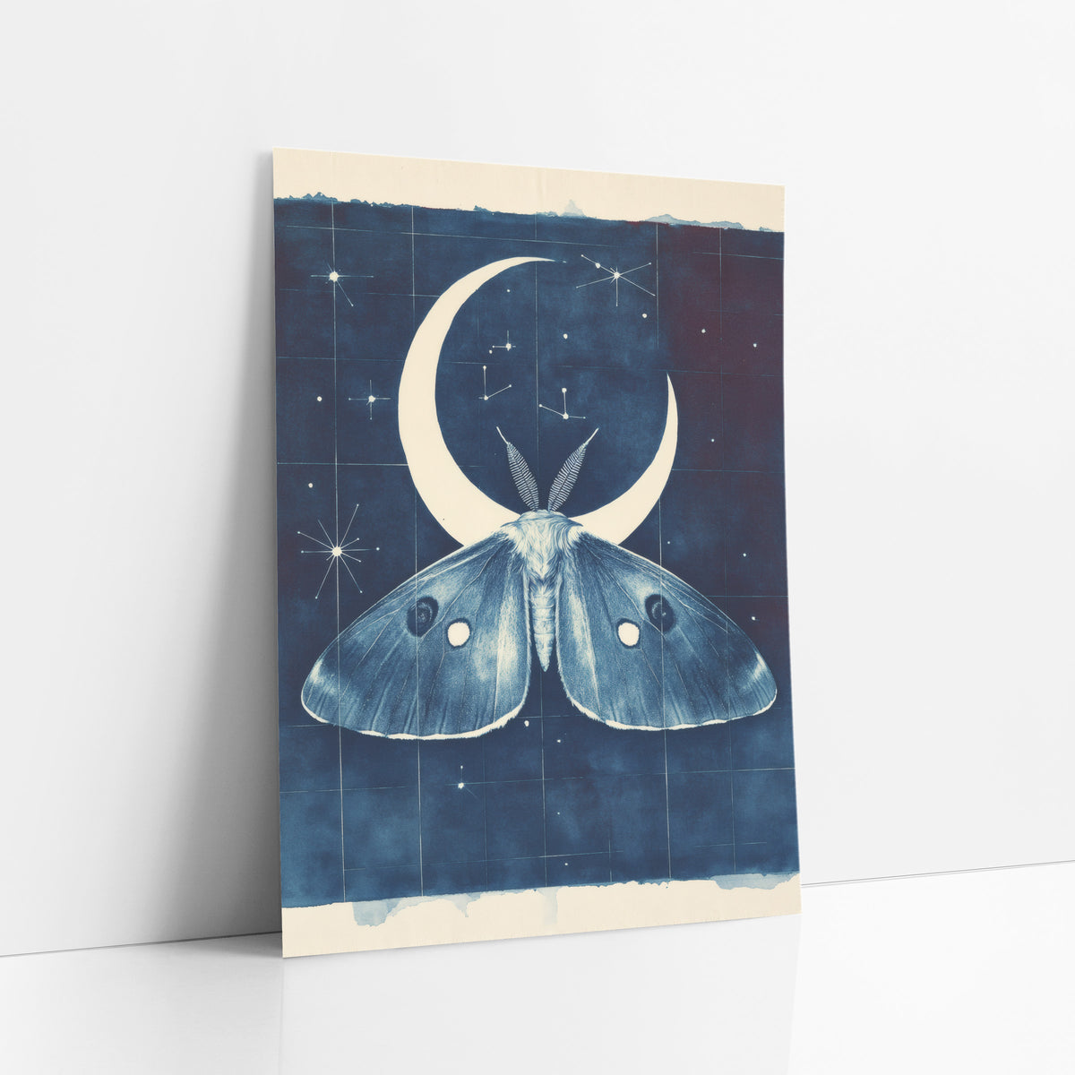 Midnight Blue Moth Crescent Celestial art print leaning against a white wall – large moth with eyespots under a cream
