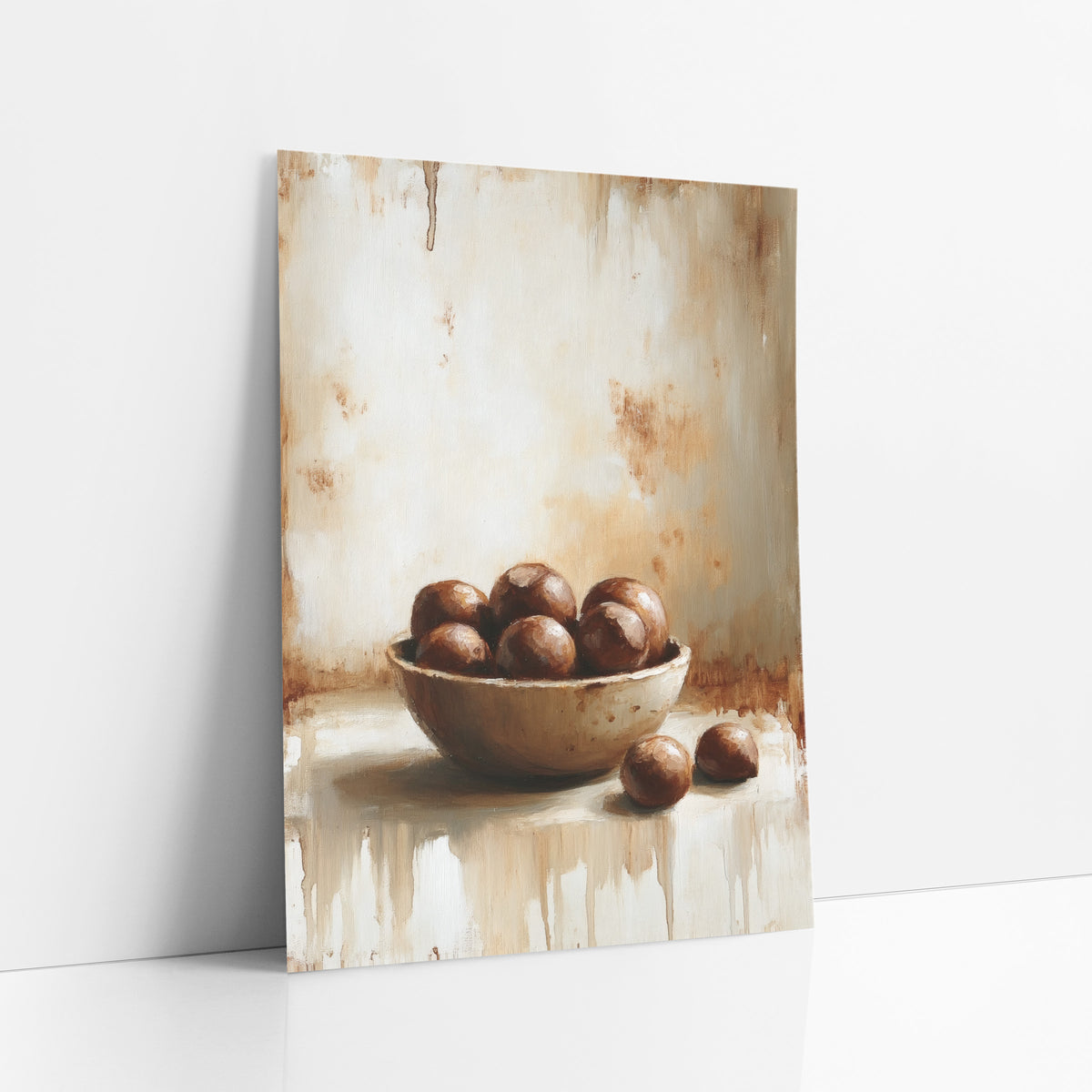 Two Chestnuts Dripping Farmhouse art print leaning against a white wall – still life of a shallow bowl of glossy brown