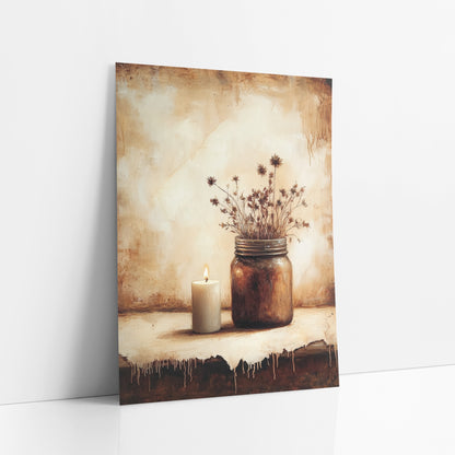 Candle Jar Drip Edge Moody art print leaning against a white wall – still life of a lit white candle beside a brown glass jar