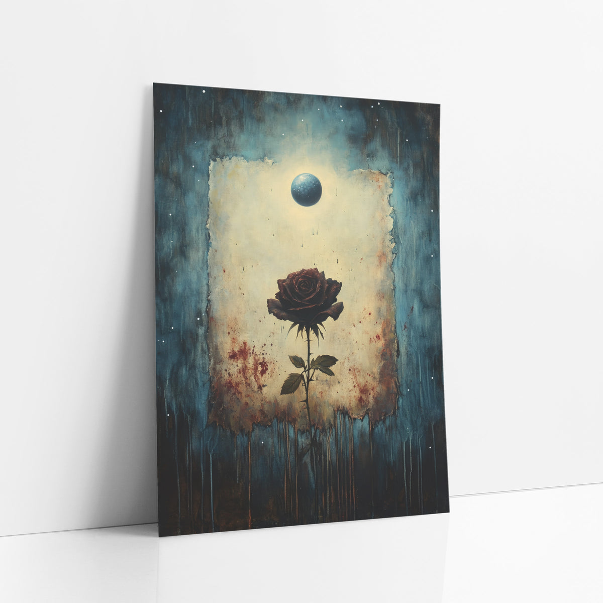 Dark Rose Under Blue Orb Gothic art print leaning against a white wall – dark burgundy rose on a thorny stem in a torn cream