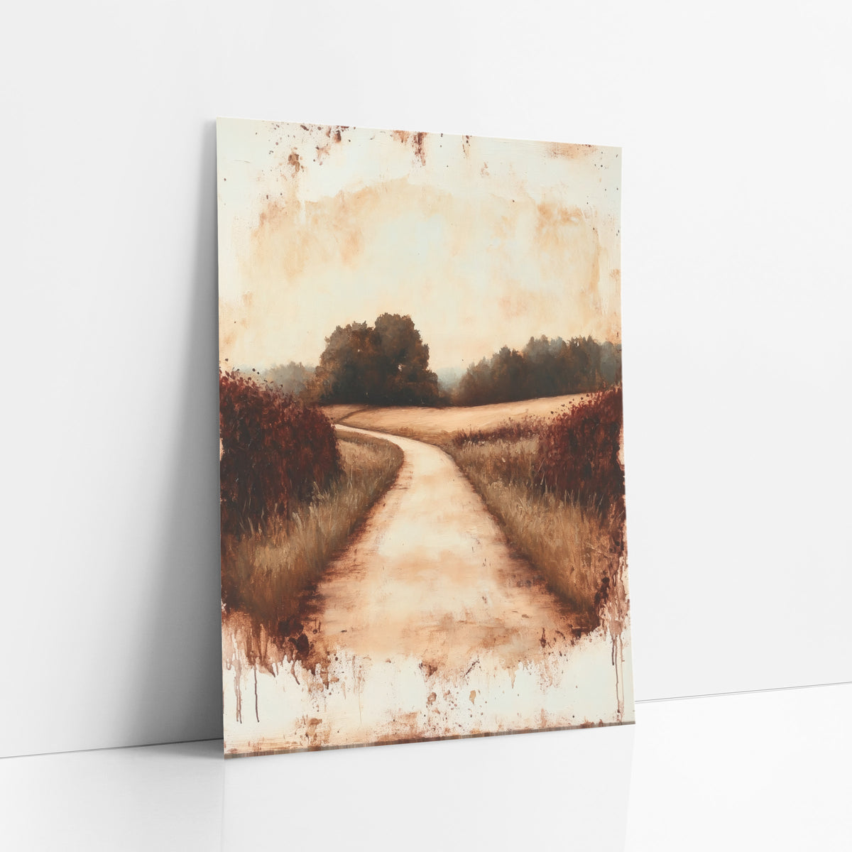 Rust Country Lane Landscape art print leaning against a white wall – winding dirt lane between tall grass and rust-red