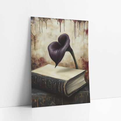Floating Calla Over Folio Gothic art print leaning against a white wall – dark purple calla lily above a worn black book