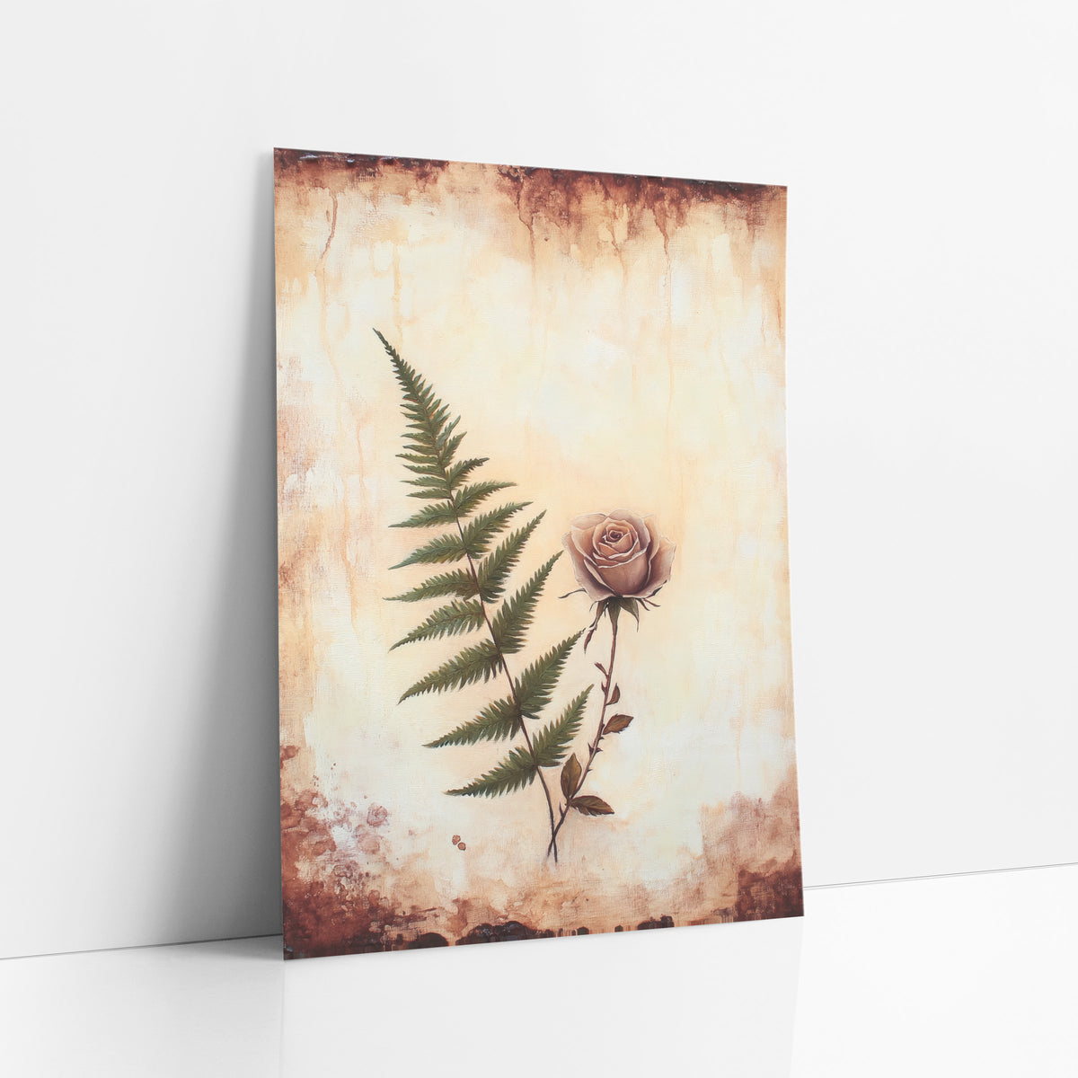 Ivory Fern Dusty Rose Vintage art print leaning against a white wall – green fern frond beside a dusty pink rose on a cream