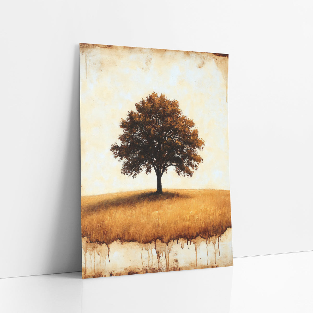 Lone Oak Golden Field Rustic art print leaning against a white wall – lone oak tree with amber-brown leaves on a golden
