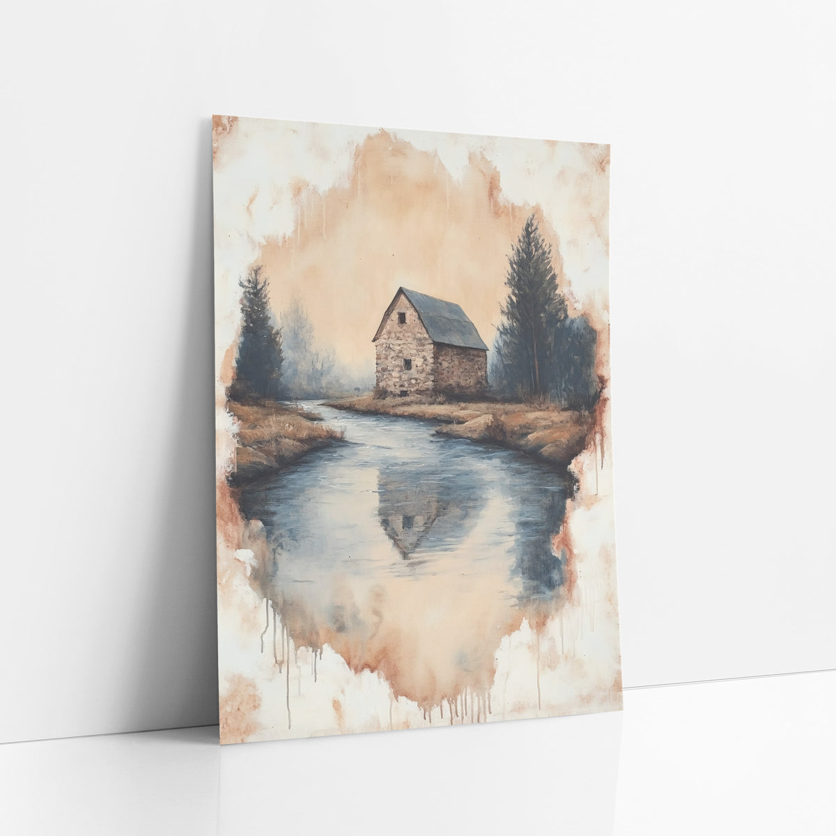 Stone Barn River Bend Landscape art print leaning against a white wall – stone barn with dark roof beside a still river bend