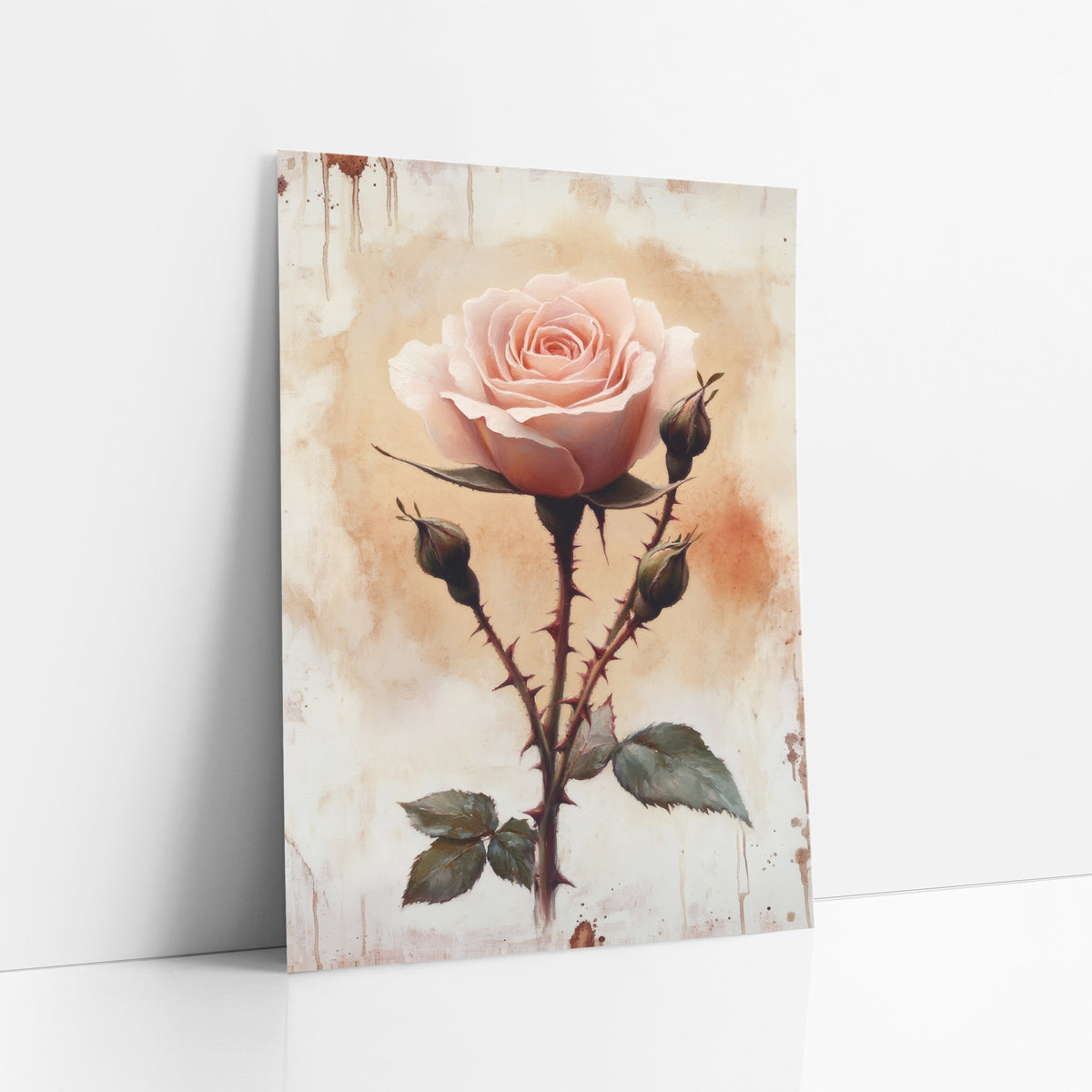 Thorned Blush Rose Buds Vintage art print leaning against a white wall – single blush pink rose with thorny stem, three green