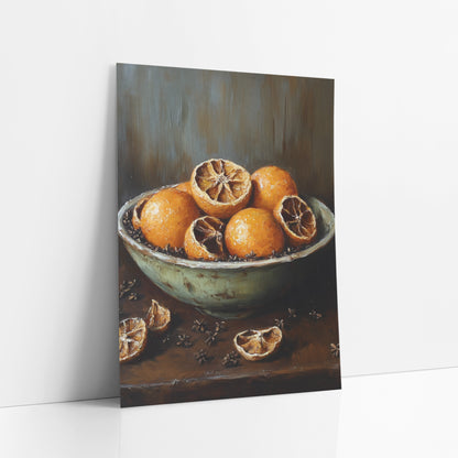 Dried Orange Bowl Still Life art print leaning against a white wall – still life of whole and halved dried oranges in a pale