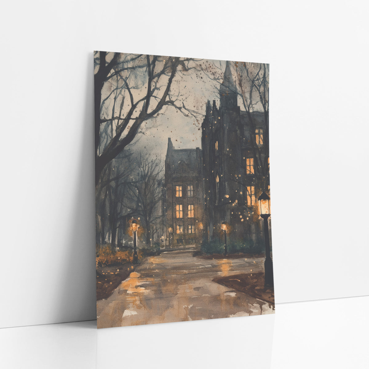 Lamplit Gothic Campus Path Academia art print leaning against a white wall – gothic stone campus buildings with glowing
