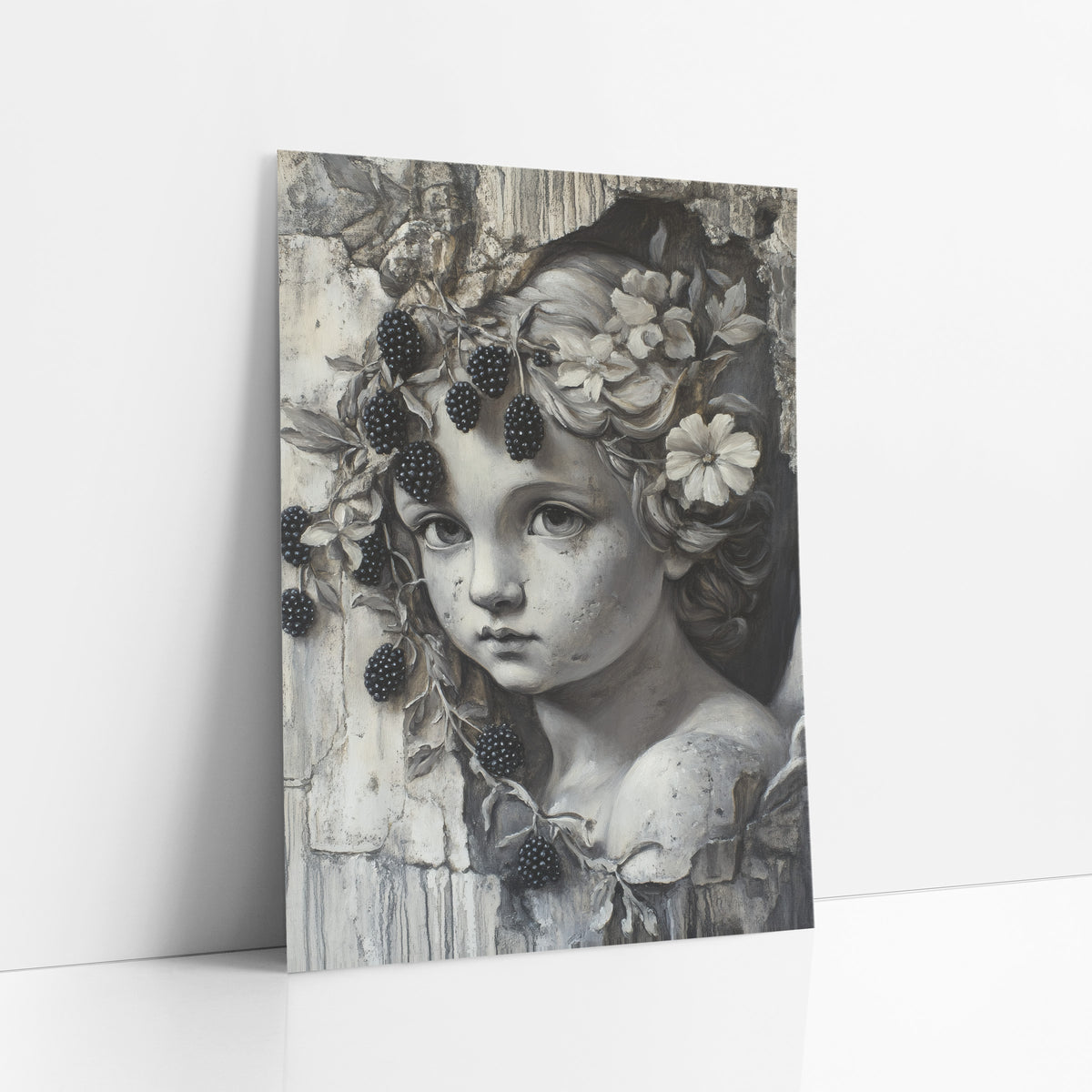 Grisaille Cherub Blackberry Vine Gothic art print leaning against a white wall – gray-toned cherub face with flowers in curly