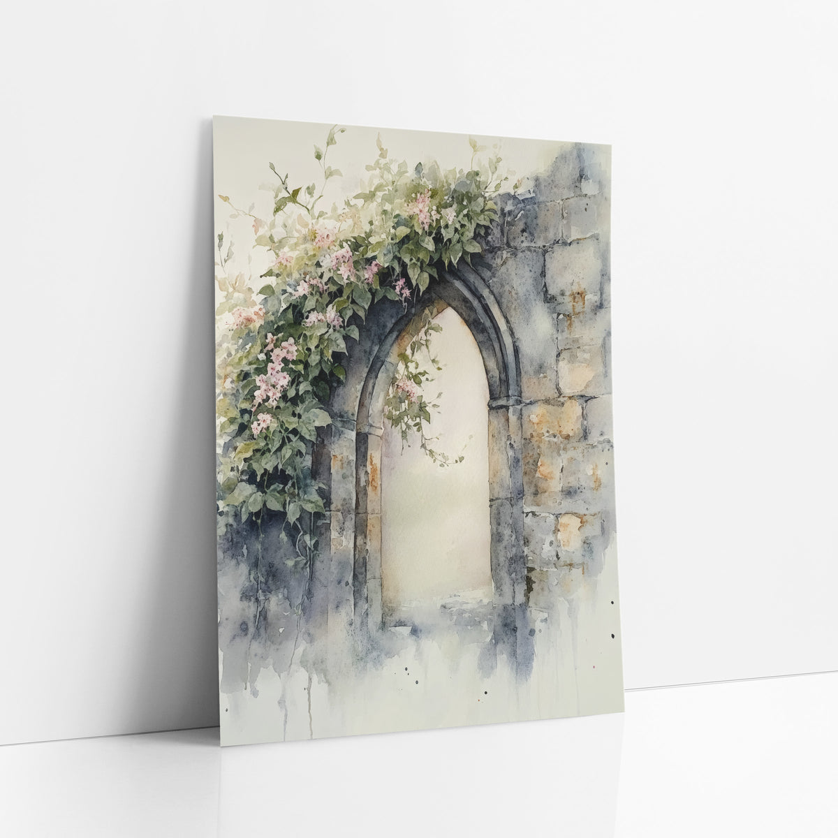 Pink Blossom Stone Arch Watercolor art print leaning against a white wall – pointed stone arch in a weathered wall