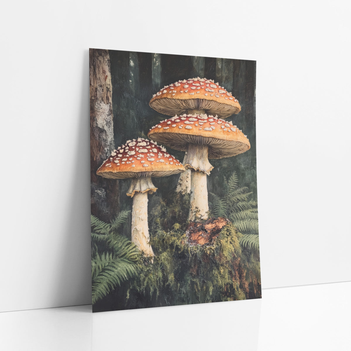 Mossy Stump Mushroom Trio Moody art print leaning against a white wall – three red-orange mushrooms with white spots