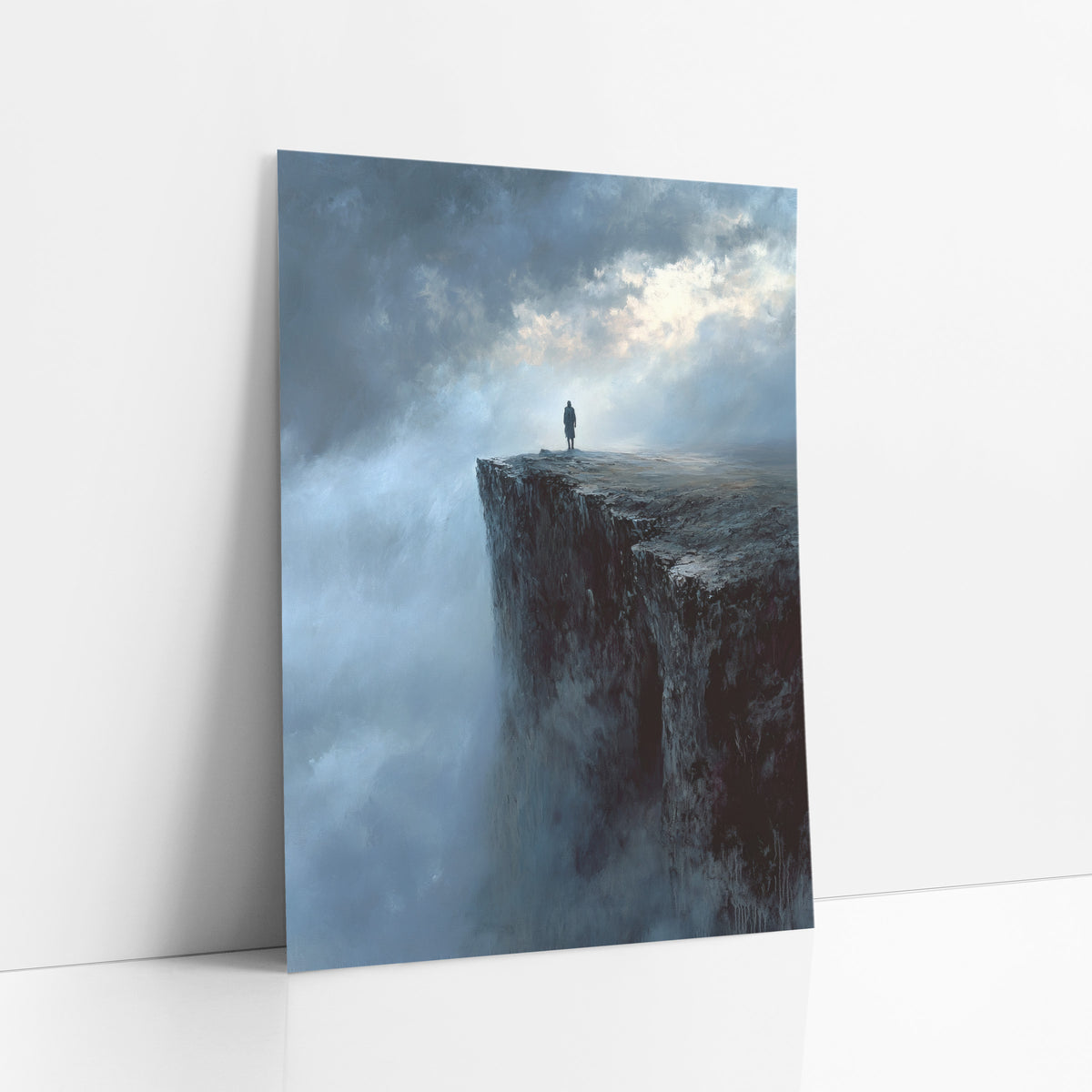 Lone Figure Misty Cliff Romantic Landscape art print leaning against a white wall – lone figure in a long coat on a dark